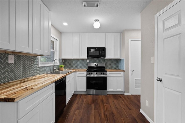 2909 15th Ave N, Texas City, TX 77590 - kitchen with black appliances, wooden counters, dark wood-type flooring, and backsplash