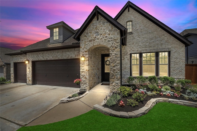 11819 Dockside Shores Dr, Cypress, TX 77433 - french country style house with a garage, concrete driveway, stone siding, and brick siding