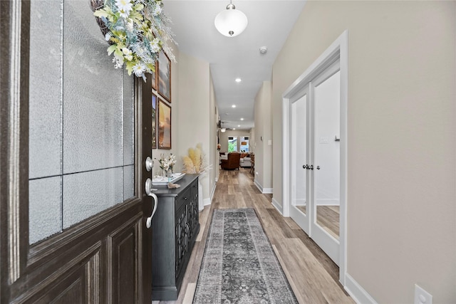 11819 Dockside Shores Dr, Cypress, TX 77433 - hallway featuring light wood-type flooring, french doors, and recessed lighting