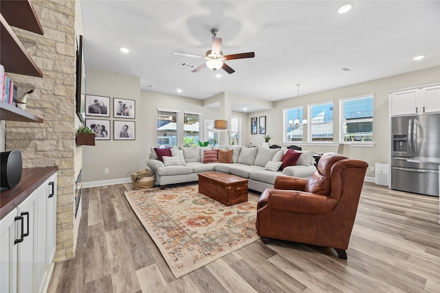 11819 Dockside Shores Dr, Cypress, TX 77433 - living area with plenty of natural light, light wood-style flooring, a ceiling fan, a chandelier, and recessed lighting