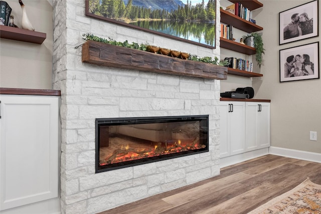 11819 Dockside Shores Dr, Cypress, TX 77433 - detailed view of a stone fireplace and wood finished floors