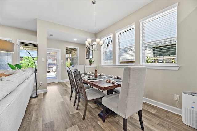 11819 Dockside Shores Dr, Cypress, TX 77433 - dining area with wood finished floors and a chandelier
