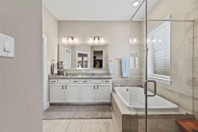 11819 Dockside Shores Dr, Cypress, TX 77433 - full bath featuring double vanity, a bath, a shower stall, and a spacious closet