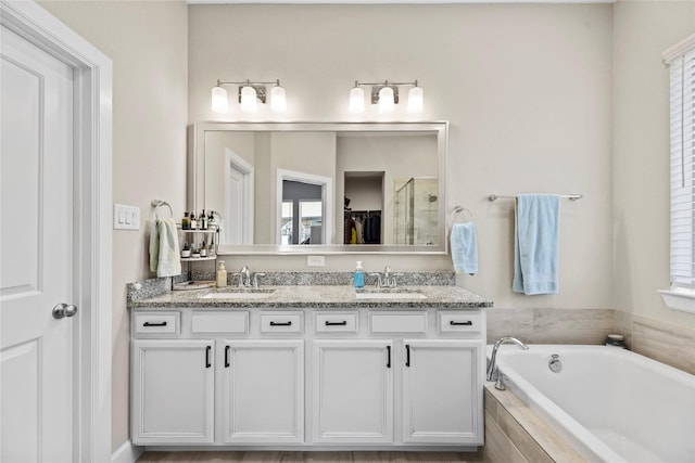 11819 Dockside Shores Dr, Cypress, TX 77433 - full bathroom with double vanity, a bath, and a shower stall