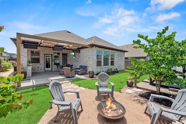 11819 Dockside Shores Dr, Cypress, TX 77433 - rear view of property featuring brick siding, roof with shingles, an outdoor living space with a fire pit, and a patio area