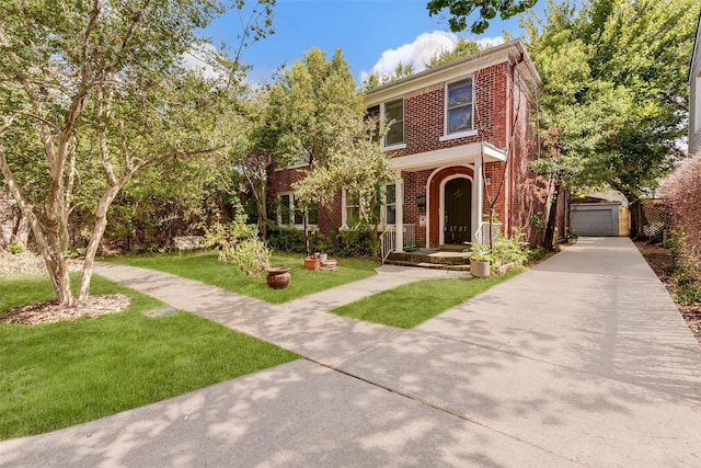 1737 Branard St, Houston, TX 77098 - view of front facade with brick siding, a front yard, a garage, and an outdoor structure