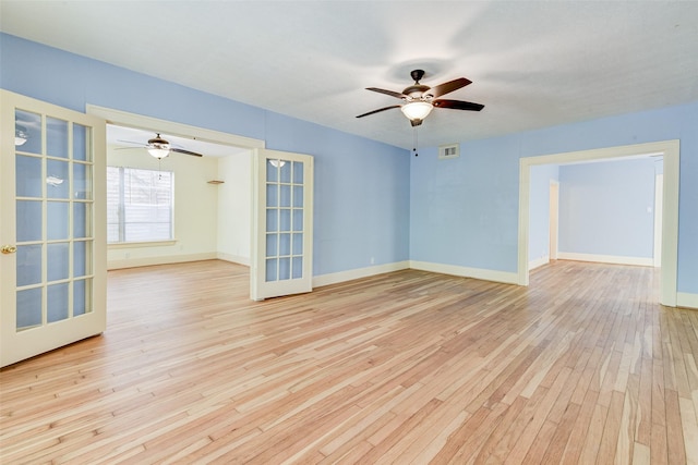 1737 Branard St, Houston, TX 77098 - empty room featuring a ceiling fan, wood-type flooring, and french doors