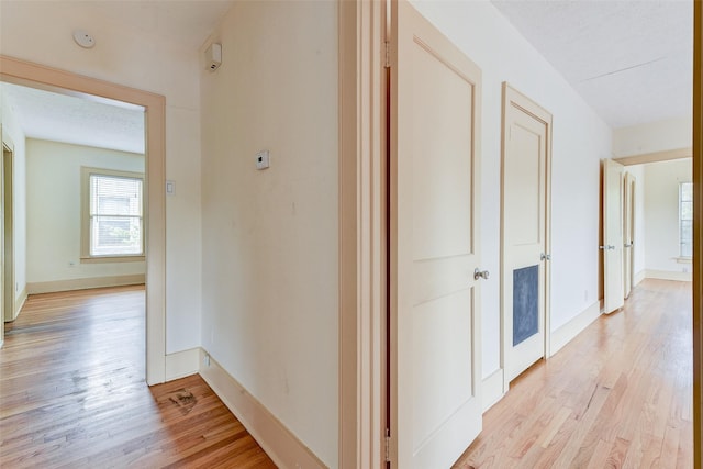 1737 Branard St, Houston, TX 77098 - hallway featuring light wood-style floors and baseboards