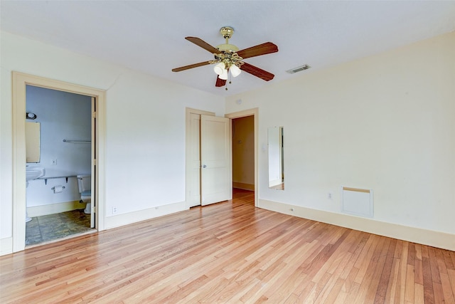 1737 Branard St, Houston, TX 77098 - unfurnished bedroom featuring light wood-type flooring and connected bathroom