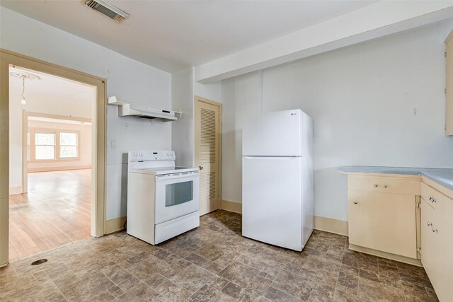 1737 Branard St, Houston, TX 77098 - kitchen with white appliances, custom exhaust hood, light countertops, light stone finish flooring, and cream cabinets