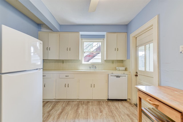 1737 Branard St, Houston, TX 77098 - kitchen featuring white appliances, light countertops, tasteful backsplash, and light wood-style floors