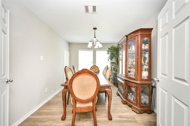14503 Brackenhurst Ln, Houston, TX 77049 - dining space with a chandelier and light wood-type flooring