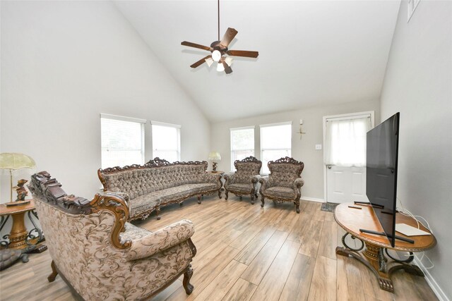 14503 Brackenhurst Ln, Houston, TX 77049 - living area featuring high vaulted ceiling, a ceiling fan, and wood finished floors