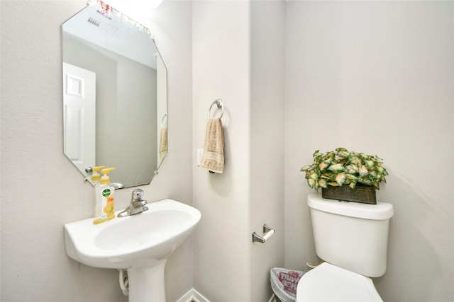 14503 Brackenhurst Ln, Houston, TX 77049 - bathroom featuring toilet and a sink