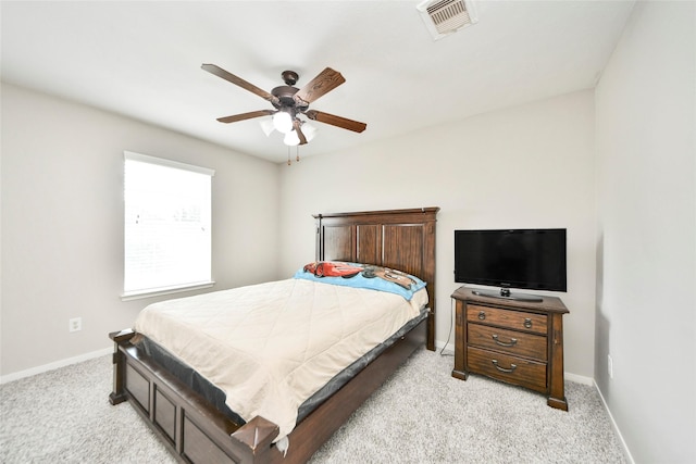 14503 Brackenhurst Ln, Houston, TX 77049 - bedroom with light colored carpet and a ceiling fan