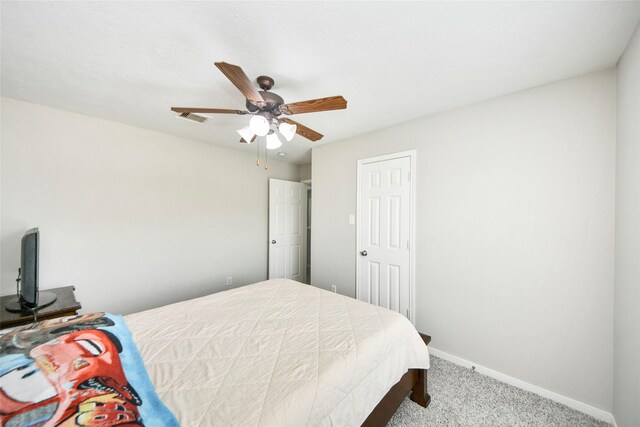 14503 Brackenhurst Ln, Houston, TX 77049 - carpeted bedroom featuring baseboards and ceiling fan