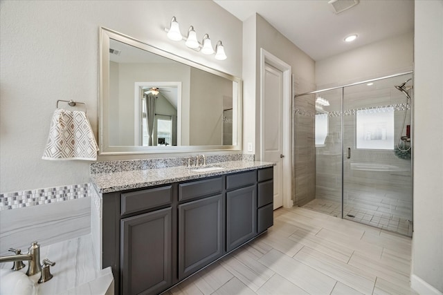 18311 Windspring Falls Ln, Cypress, TX 77433 - bathroom featuring vanity, a shower stall, and ceiling fan