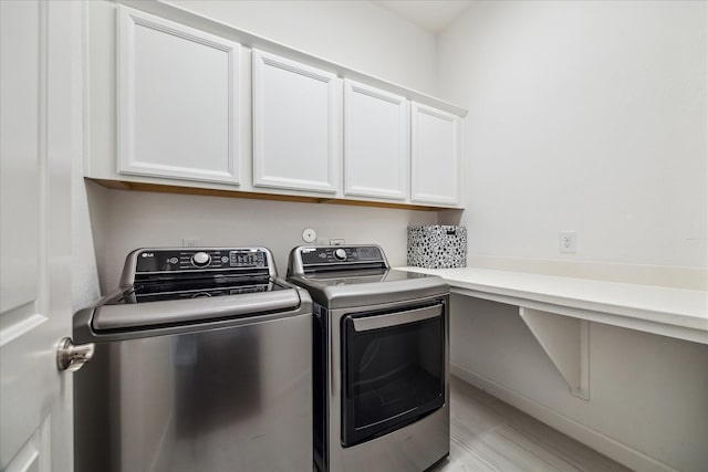 18311 Windspring Falls Ln, Cypress, TX 77433 - washroom featuring cabinet space and washer and clothes dryer