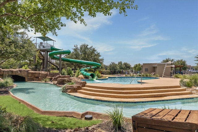 18311 Windspring Falls Ln, Cypress, TX 77433 - community pool featuring a water slide