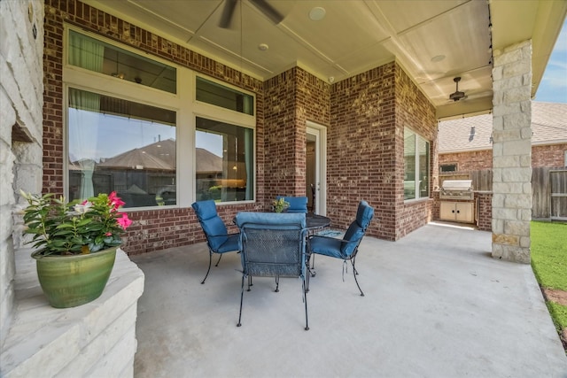 18311 Windspring Falls Ln, Cypress, TX 77433 - view of patio featuring an outdoor kitchen and outdoor dining area