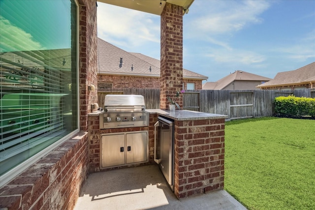 18311 Windspring Falls Ln, Cypress, TX 77433 - fenced backyard featuring exterior kitchen