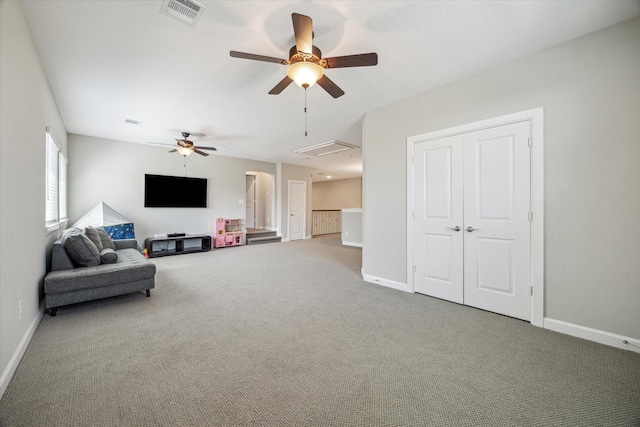18311 Windspring Falls Ln, Cypress, TX 77433 - living area with attic access, ceiling fan, and carpet floors