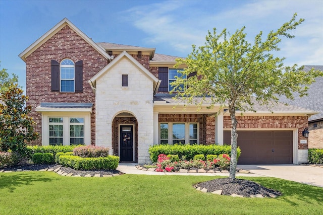 18311 Windspring Falls Ln, Cypress, TX 77433 - view of front of house with brick siding and a front yard