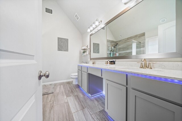 1509 Grayson Oaks Pl, Houston, TX 77043 - full bath featuring double vanity, lofted ceiling, and a stall shower