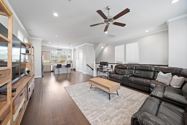 1509 Grayson Oaks Pl, Houston, TX 77043 - living area with recessed lighting, crown molding, ceiling fan, and dark wood-style flooring