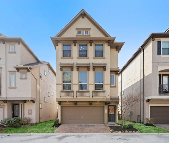 1509 Grayson Oaks Pl, Houston, TX 77043 - multi unit property featuring stucco siding, a garage, and decorative driveway