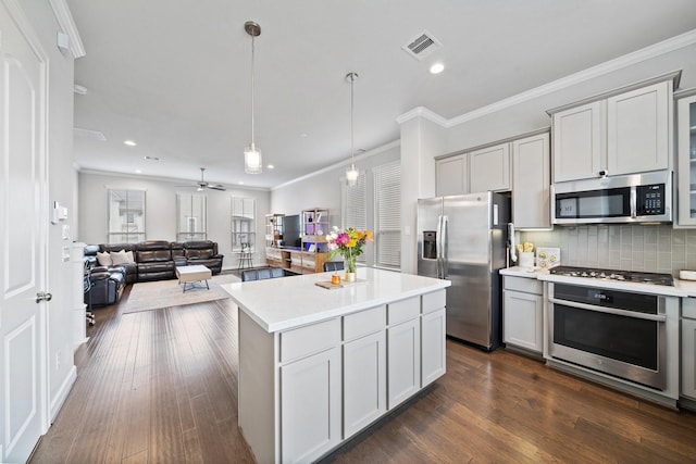 1509 Grayson Oaks Pl, Houston, TX 77043 - kitchen with appliances with stainless steel finishes, gray cabinets, light countertops, tasteful backsplash, and open floor plan