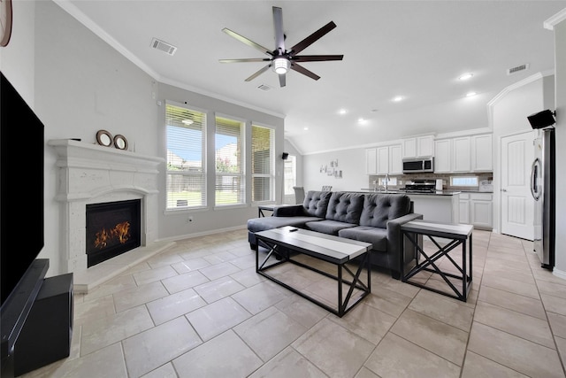 21283 Lily Springs Dr, Porter, TX 77365 - living area featuring crown molding, a ceiling fan, recessed lighting, light tile patterned floors, and a premium fireplace