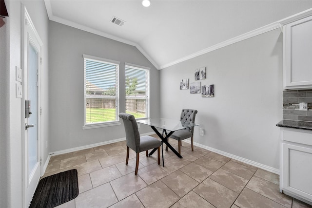 21283 Lily Springs Dr, Porter, TX 77365 - dining space with vaulted ceiling, ornamental molding, and light tile patterned flooring