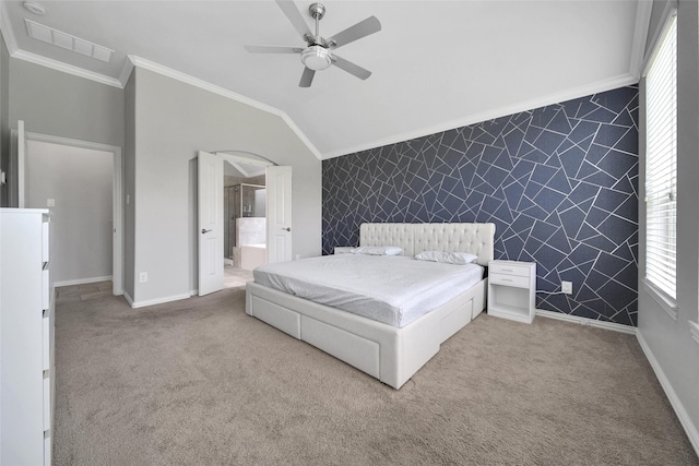 21283 Lily Springs Dr, Porter, TX 77365 - carpeted bedroom featuring an accent wall, ornamental molding, wallpapered walls, vaulted ceiling, and ceiling fan