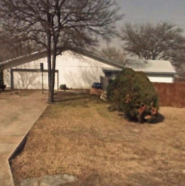 1810 S W Dr, Leander, TX 78641 - view of yard featuring a garage