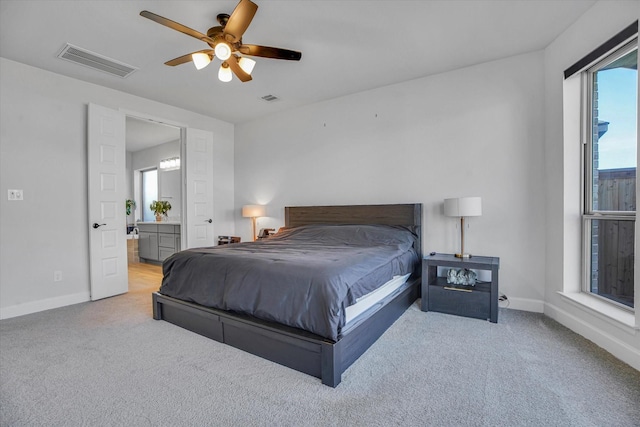 18702 Denio Site Dr, Cypress, TX 77433 - bedroom with carpet, connected bathroom, and ceiling fan