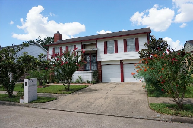 12210 Cliffgate Dr, Houston, TX 77072 - raised ranch with a garage, driveway, and a chimney