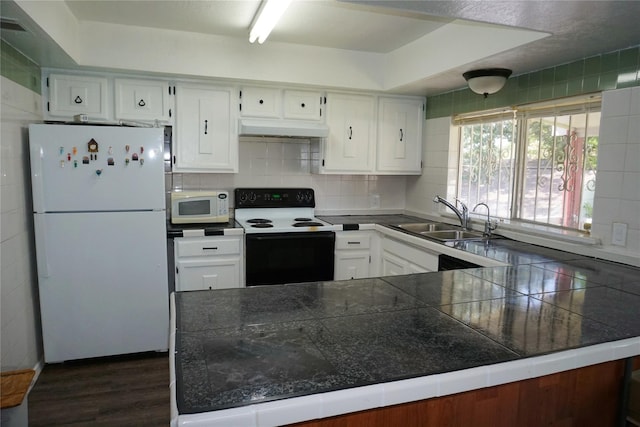 12210 Cliffgate Dr, Houston, TX 77072 - kitchen featuring white appliances, under cabinet range hood, and white cabinets