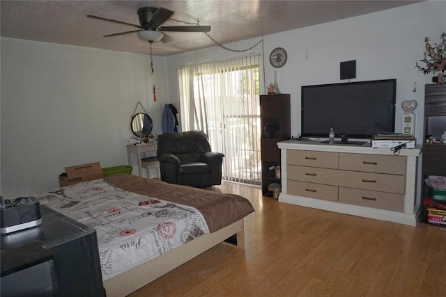 12210 Cliffgate Dr, Houston, TX 77072 - bedroom with light wood-type flooring and a ceiling fan