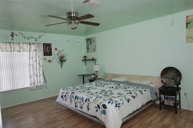 12210 Cliffgate Dr, Houston, TX 77072 - bedroom with wood finished floors and a ceiling fan