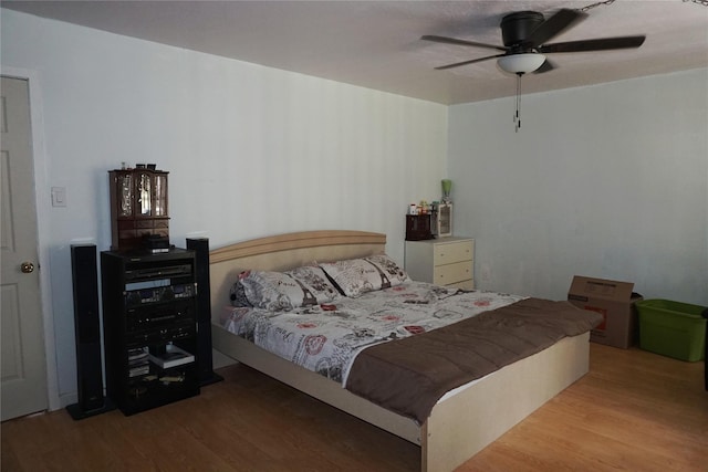 12210 Cliffgate Dr, Houston, TX 77072 - bedroom featuring wood finished floors and a ceiling fan