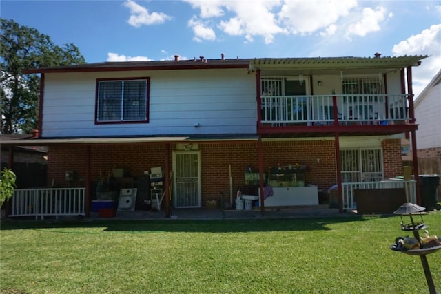 12210 Cliffgate Dr, Houston, TX 77072 - back of house featuring a balcony, a patio, a yard, and brick siding