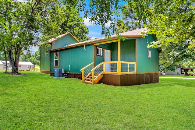 220 Tortuga Way, Point Blank, TX 77364 - back of property featuring a yard and entry steps