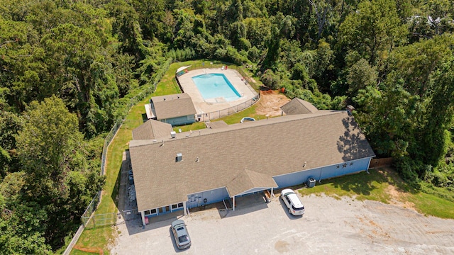 220 Tortuga Way, Point Blank, TX 77364 - aerial view of property and surrounding area featuring a pool and a forest
