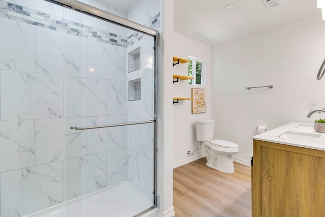 220 Tortuga Way, Point Blank, TX 77364 - bathroom with a shower stall, vanity, and wood finished floors