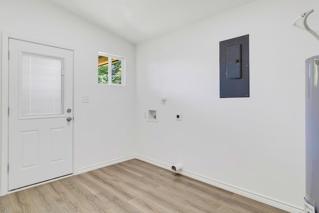220 Tortuga Way, Point Blank, TX 77364 - laundry area featuring electric panel, hookup for an electric dryer, light wood-type flooring, and washer hookup