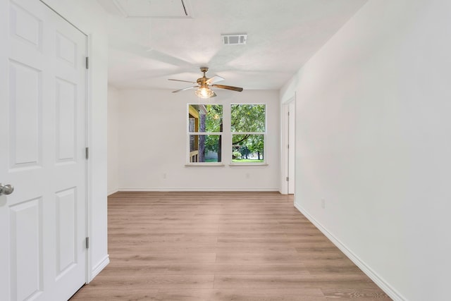 220 Tortuga Way, Point Blank, TX 77364 - spare room featuring attic access, a ceiling fan, and light wood-type flooring