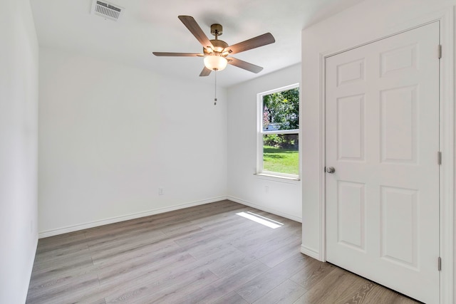 220 Tortuga Way, Point Blank, TX 77364 - empty room with ceiling fan and light wood-style floors