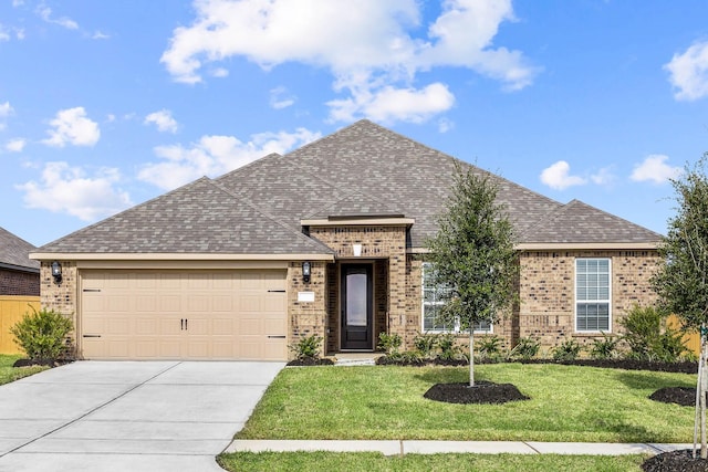 3114 Banyan Dr, Texas City, TX 77510 - view of front of home featuring brick siding, an attached garage, driveway, a front yard, and a shingled roof