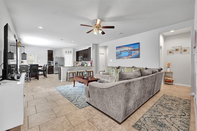 1410 Woods Lake Ct, Houston, TX 77047 - living room with a ceiling fan, light tile patterned floors, and recessed lighting